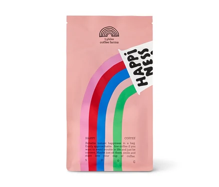 Rosa Kaffeepackung von Lykke mit Regenbogen-Design und der Aufschrift 'HAPPINESS Omni-Roast', 500 g ganze Bohnen.