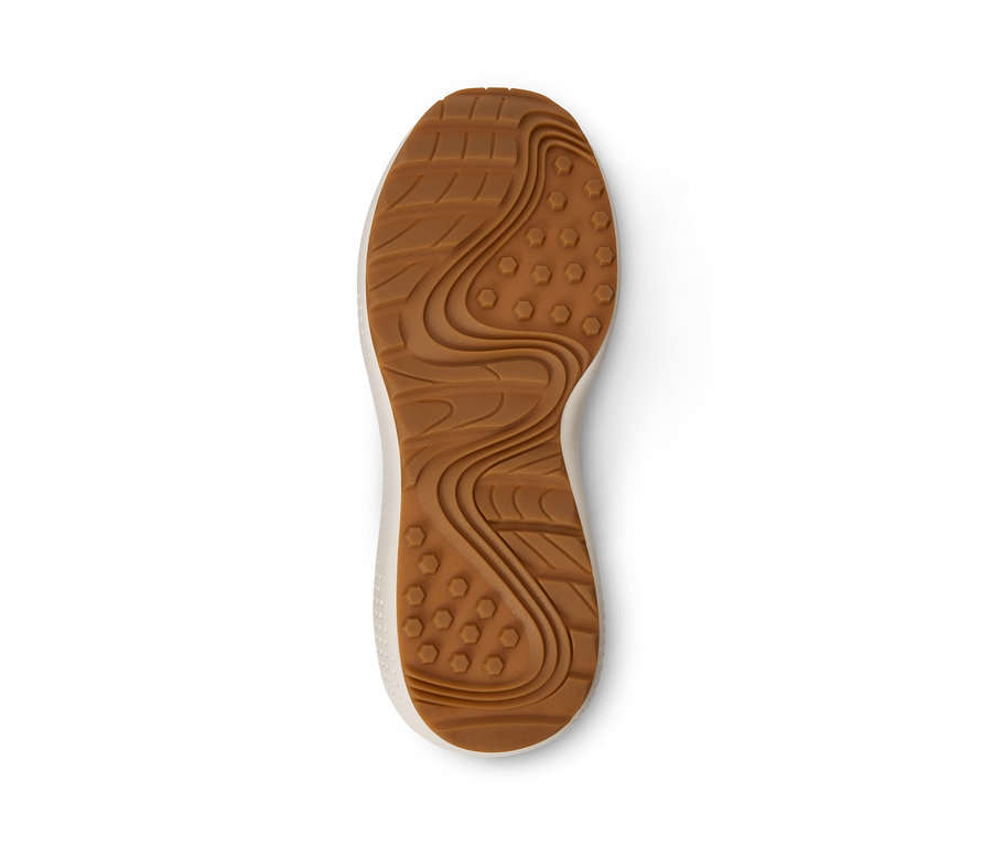 Braune Sohle eines Sneakers auf weißem Hintergrund.