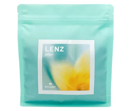 Hellblaue Packung Heilandt Lenz Filter mit gelb-weissem Aquarellbild auf weissem Etikett.